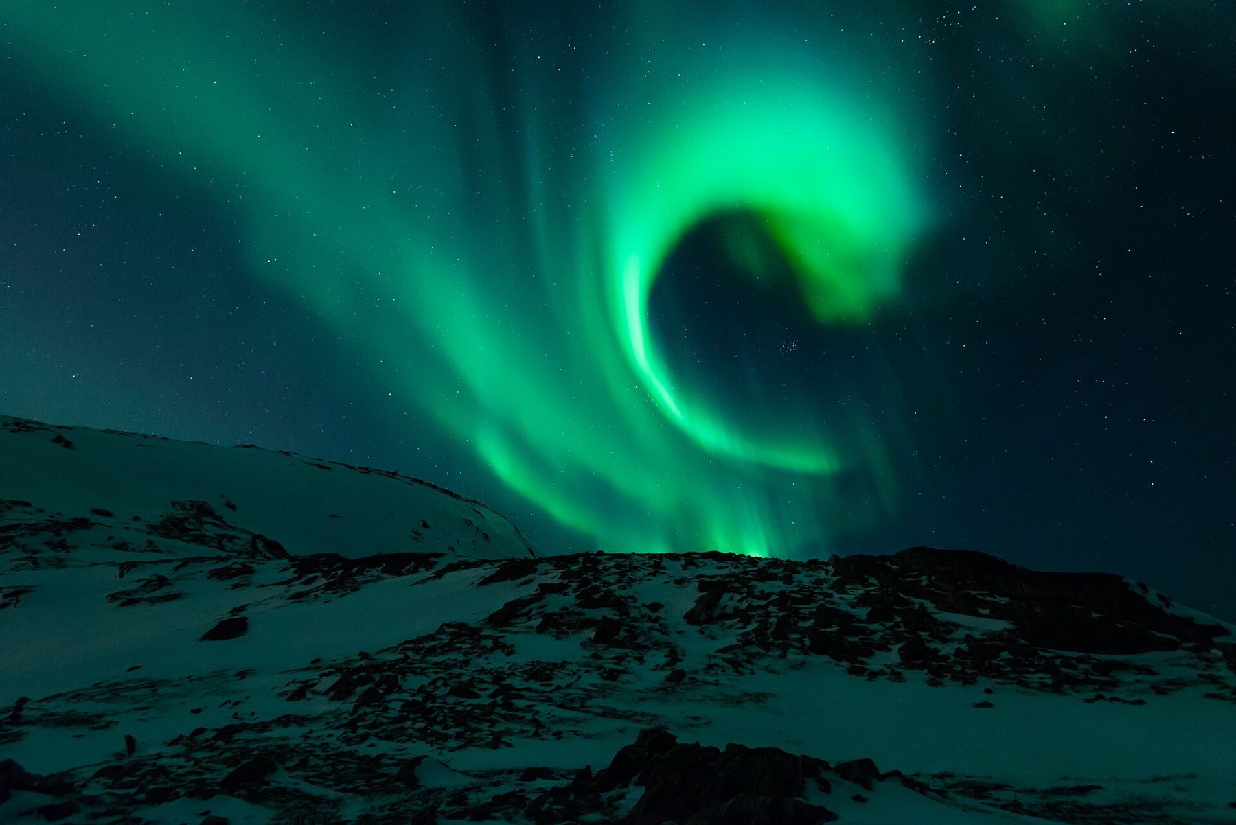 Aurora spiral over snow